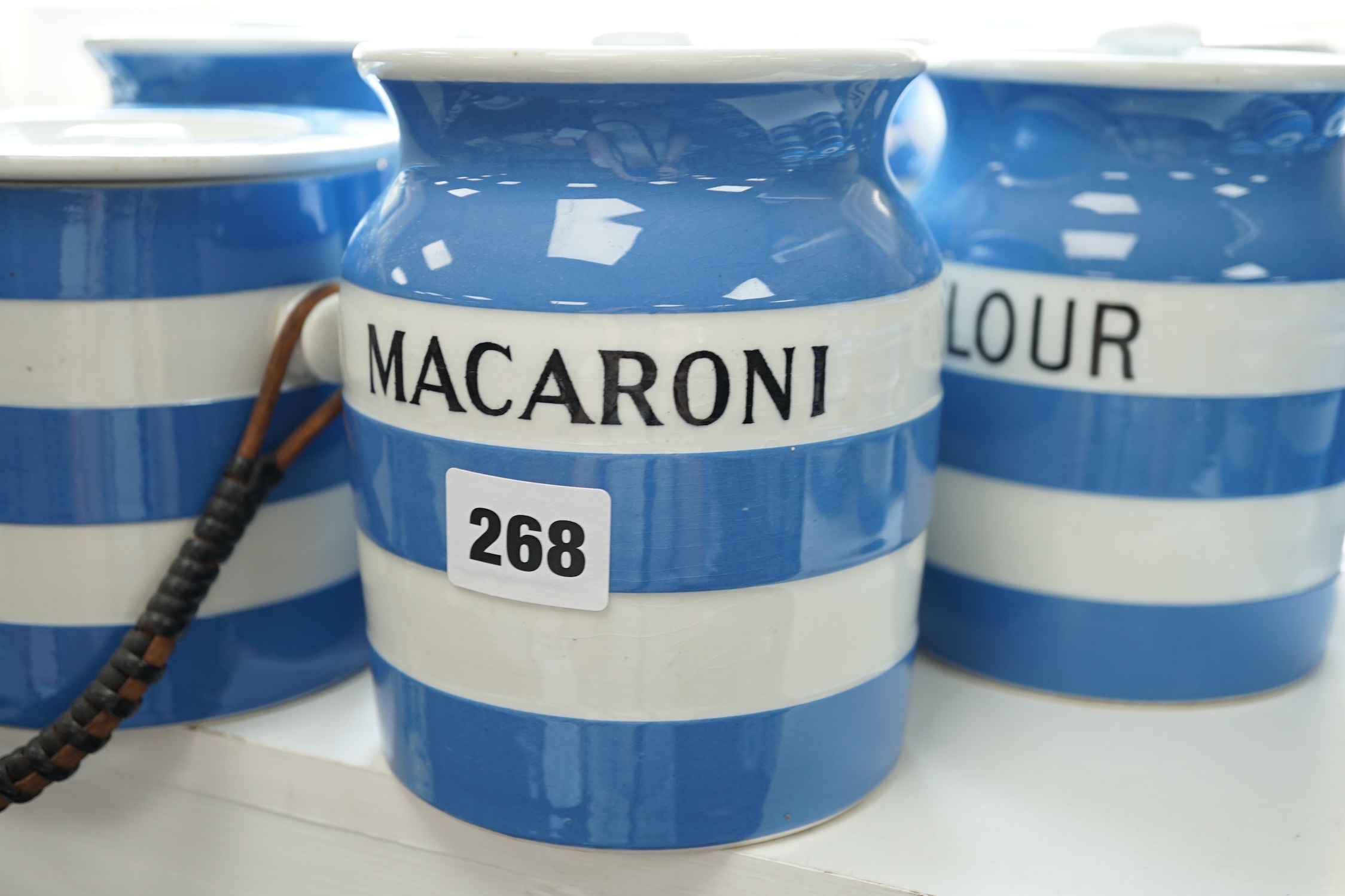 T.G.Green Cornish Kitchenware, seven 14cm lidded storage jars to include Vermicelli, Macaroni, Treacle, Biscuits and Prunes with a smaller Biscuit jar and cover, mainly Green Church marks. Condition - poor, fair and good